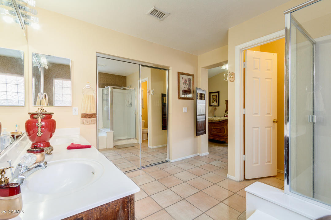 4030 West Cactus Road Phoenix, AZ 85029 - Photo 20 of 29 a spacious bathroom with a sink mirror and shower