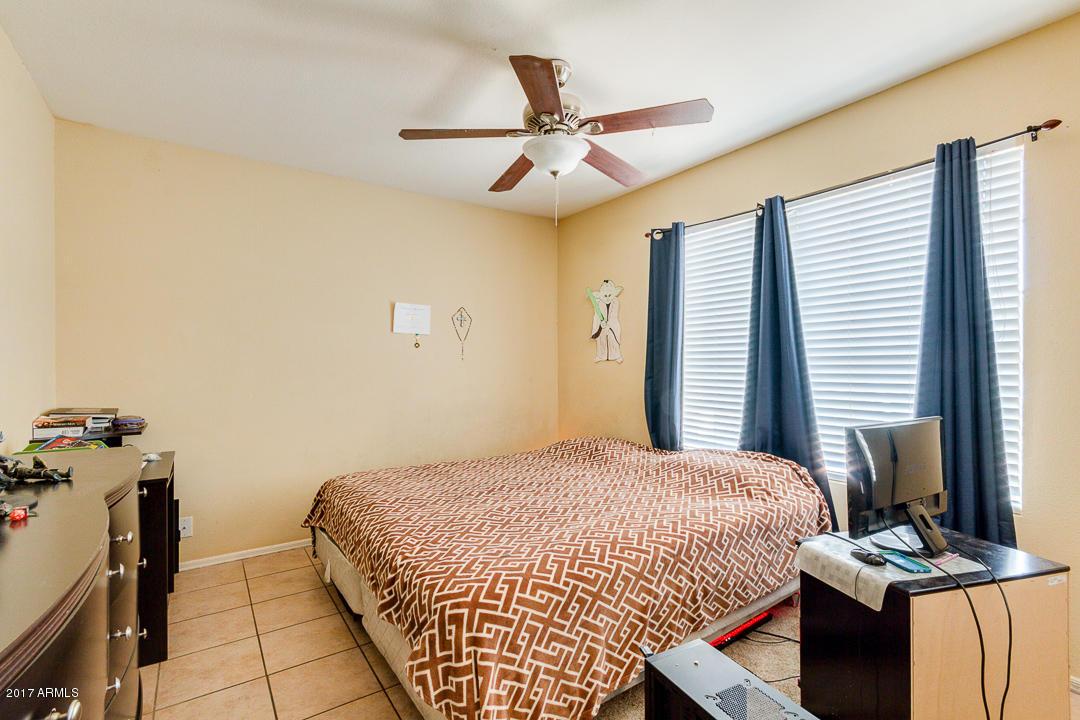 4030 West Cactus Road Phoenix, AZ 85029 - Photo 23 of 29 a bedroom with bed and a window