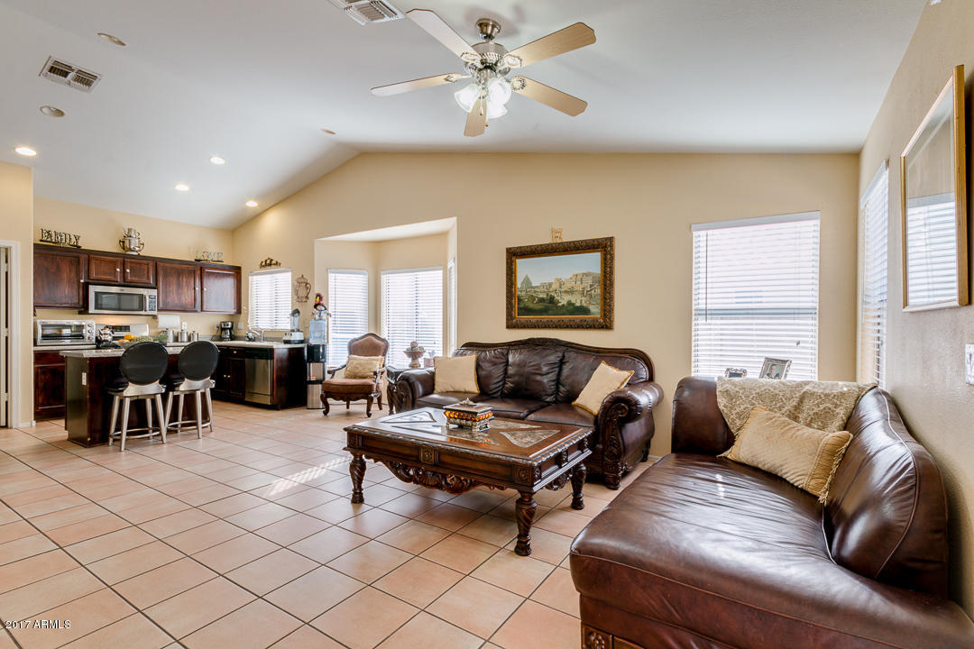 4030 West Cactus Road Phoenix, AZ 85029 - Photo 3 of 29 a living room with furniture and a large window