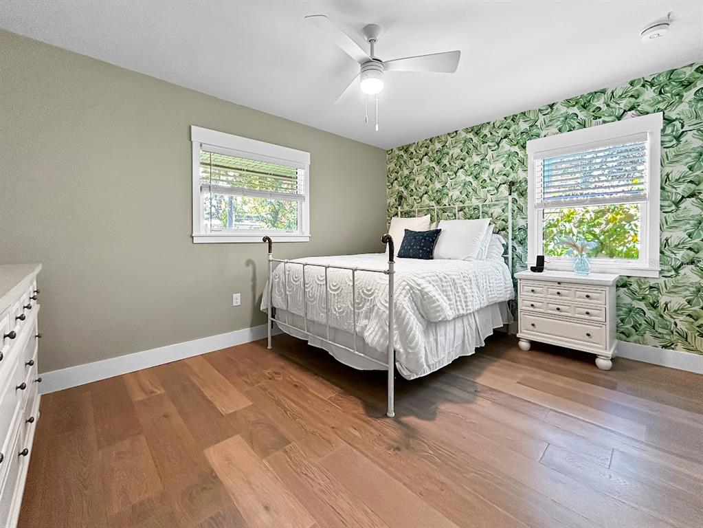 2908 West San Rafael Street Tampa, FL 33629 - Photo 21 of 27 a bedroom with a bed wooden floor and window