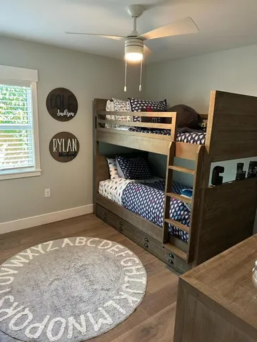 a view of a room with furniture and window