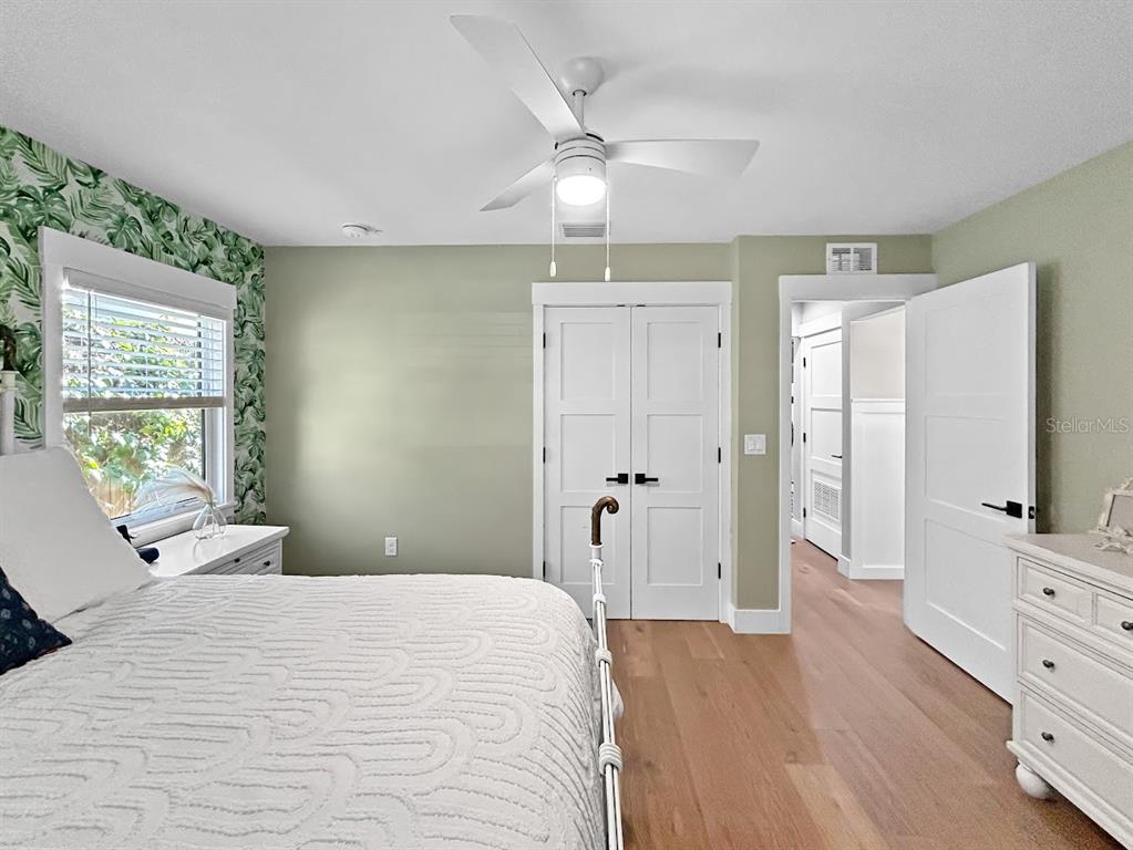 2908 West San Rafael Street Tampa, FL 33629 - Photo 22 of 27 a bedroom with a bed and a flat tv screen on dresser