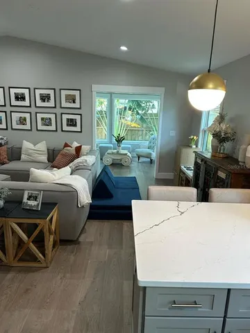 a bed room with a bed and a chandelier