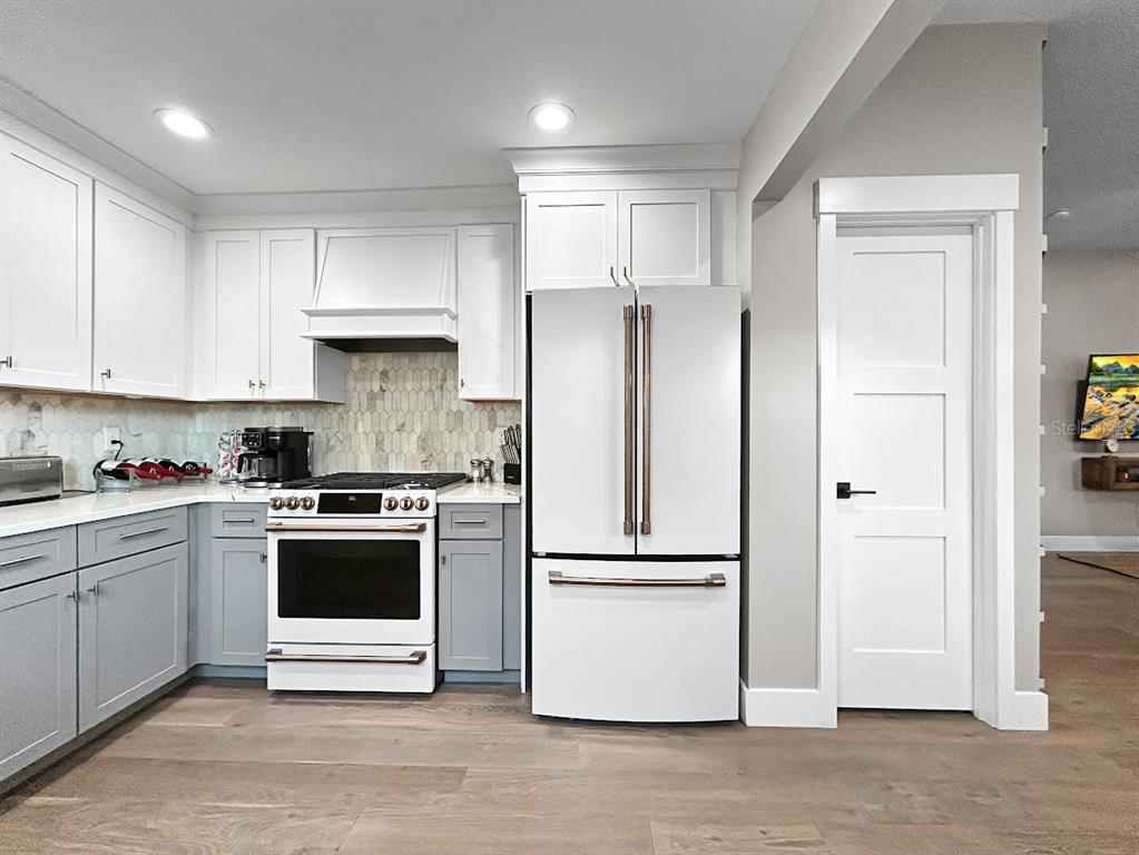 2908 West San Rafael Street Tampa, FL 33629 - Photo 6 of 27 a kitchen with stainless steel appliances granite countertop a refrigerator and a stove top oven