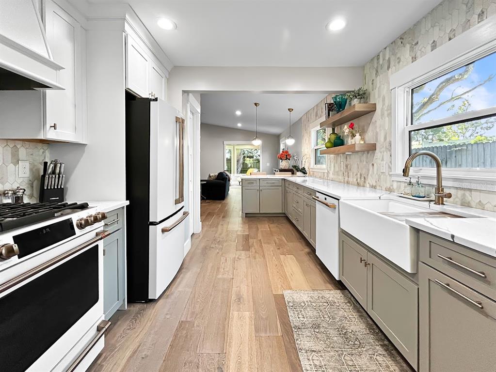 2908 West San Rafael Street Tampa, FL 33629 - Photo 7 of 27 a large kitchen with a large counter top space a sink stainless steel appliances and cabinets