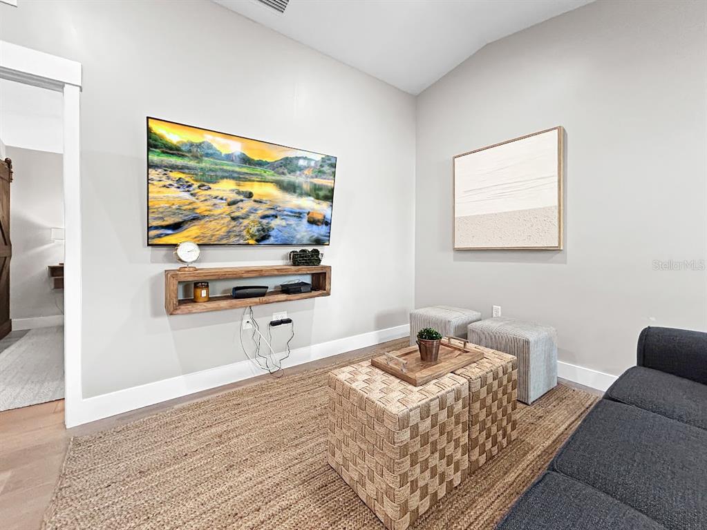 2908 West San Rafael Street Tampa, FL 33629 - Photo 10 of 27 a living room with furniture and a flat screen tv