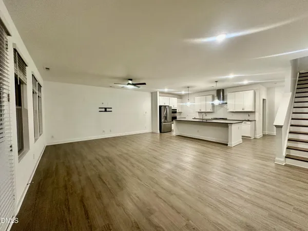 a view of kitchen with wooden floor