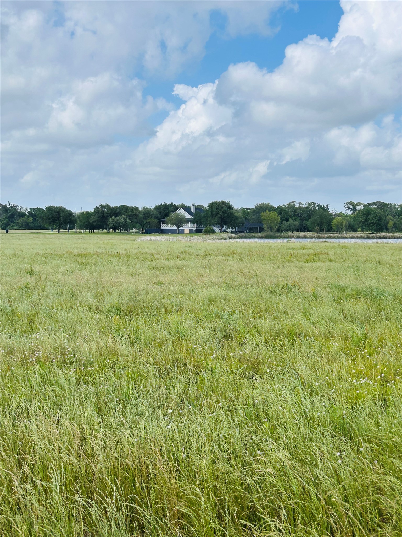 0 Conestoga Trail Angleton, TX 77515 - Photo 4 of 4 a view of a lake and mountain