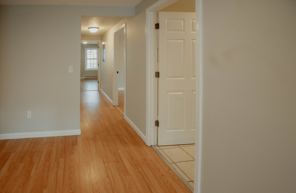 27 Kendall Street Barre, MA 01005 - Photo 14 of 40 a view of a hallway with wooden floor