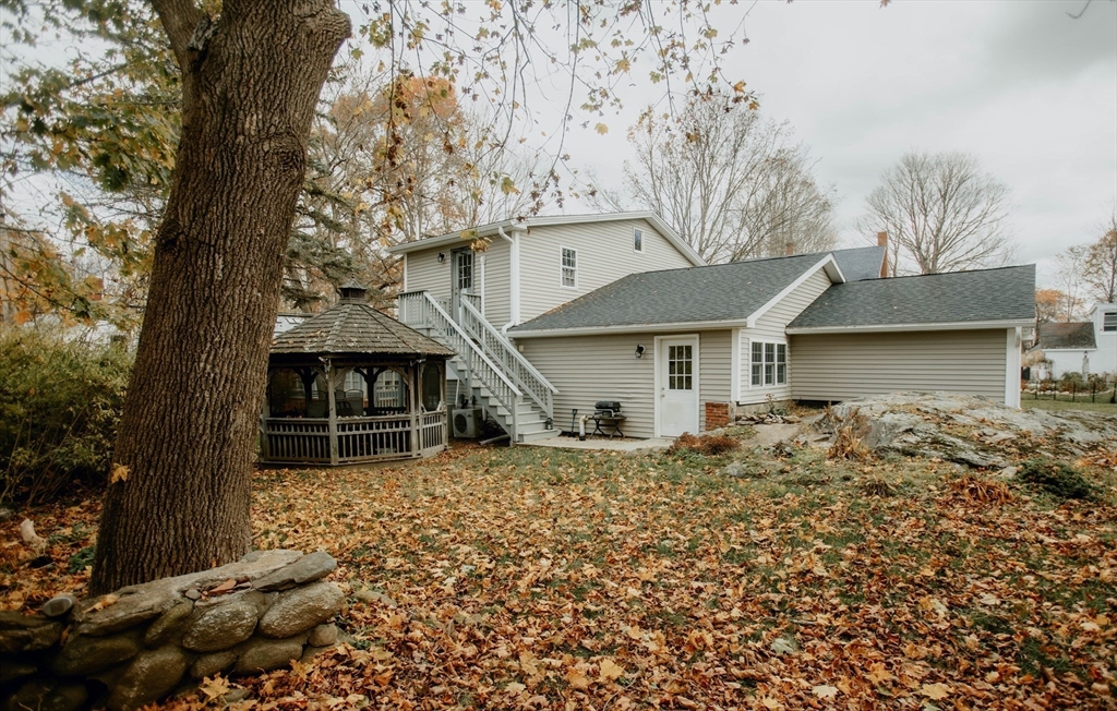 27 Kendall Street Barre, MA 01005 - Photo 3 of 40 front view of a house with a large tree