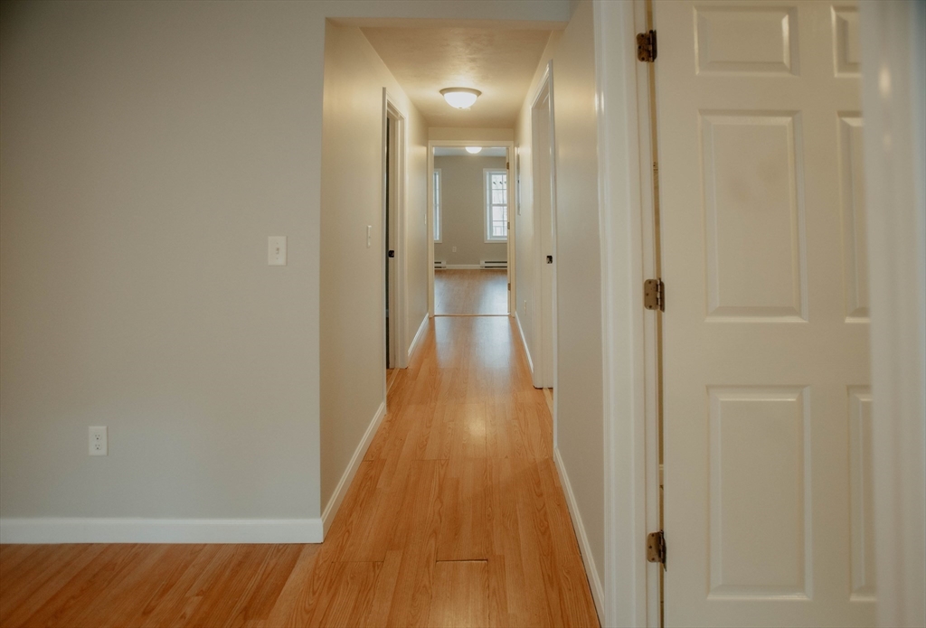 27 Kendall Street Barre, MA 01005 - Photo 32 of 40 a view of a hallway with wooden floor