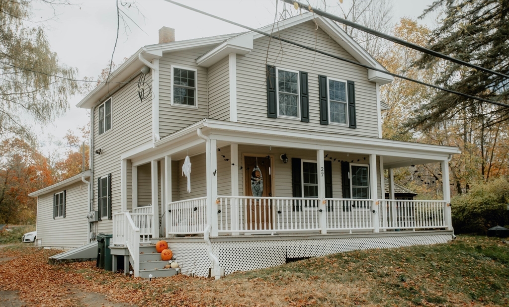 27 Kendall Street Barre, MA 01005 - Photo 35 of 40 a view of a white house with large windows next to a road