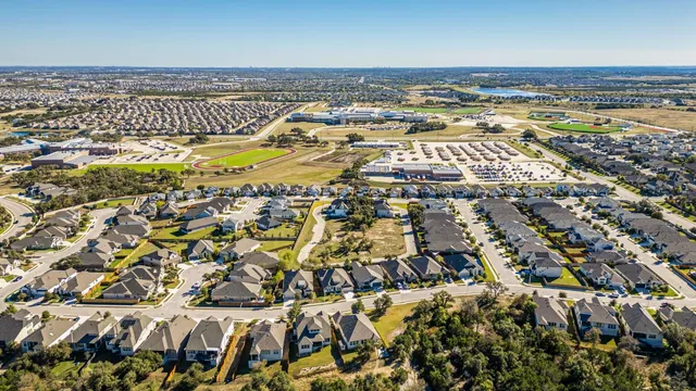 an aerial view of residential building and ocean