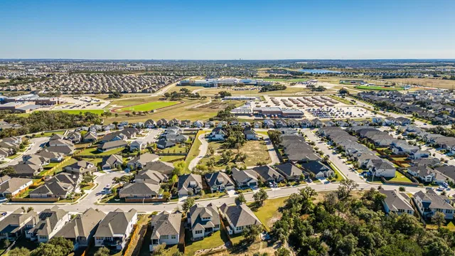 an aerial view of a water and mountain