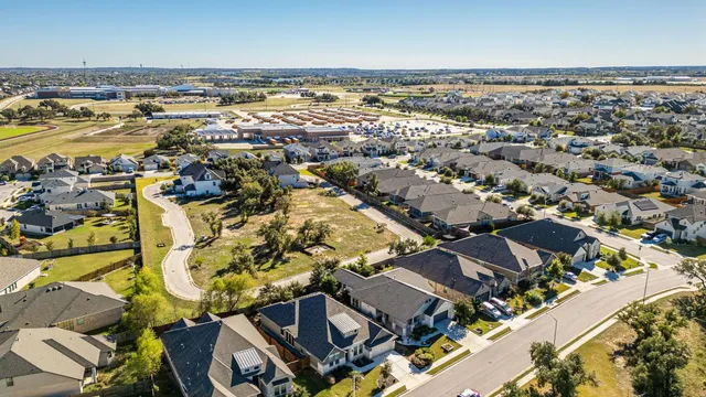 an aerial view of residential building and lake view