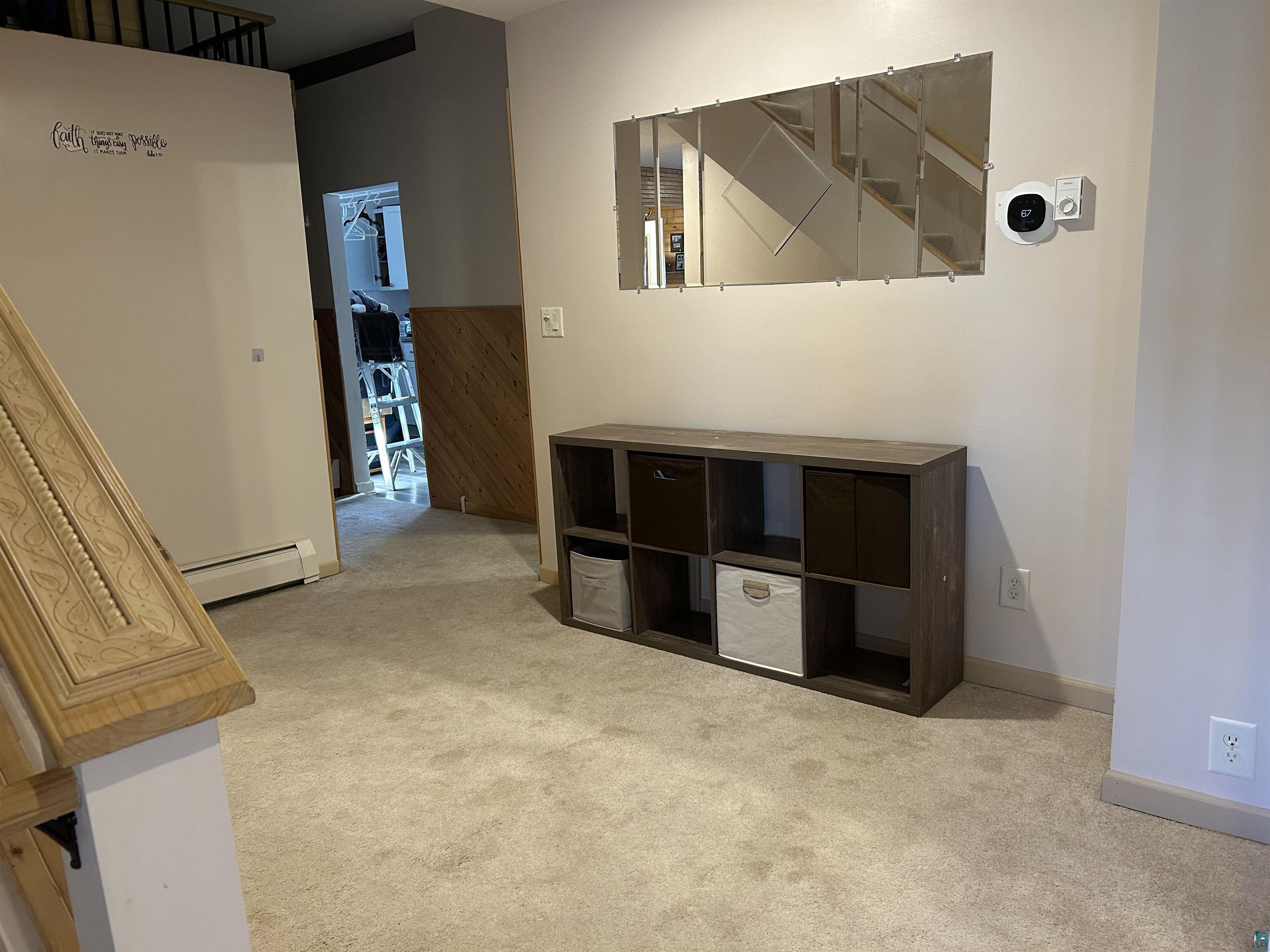 8655 South Lyman Lake Road South Range, WI 54874 - Photo 60 of 64 Corridor featuring light carpet and a baseboard radiator