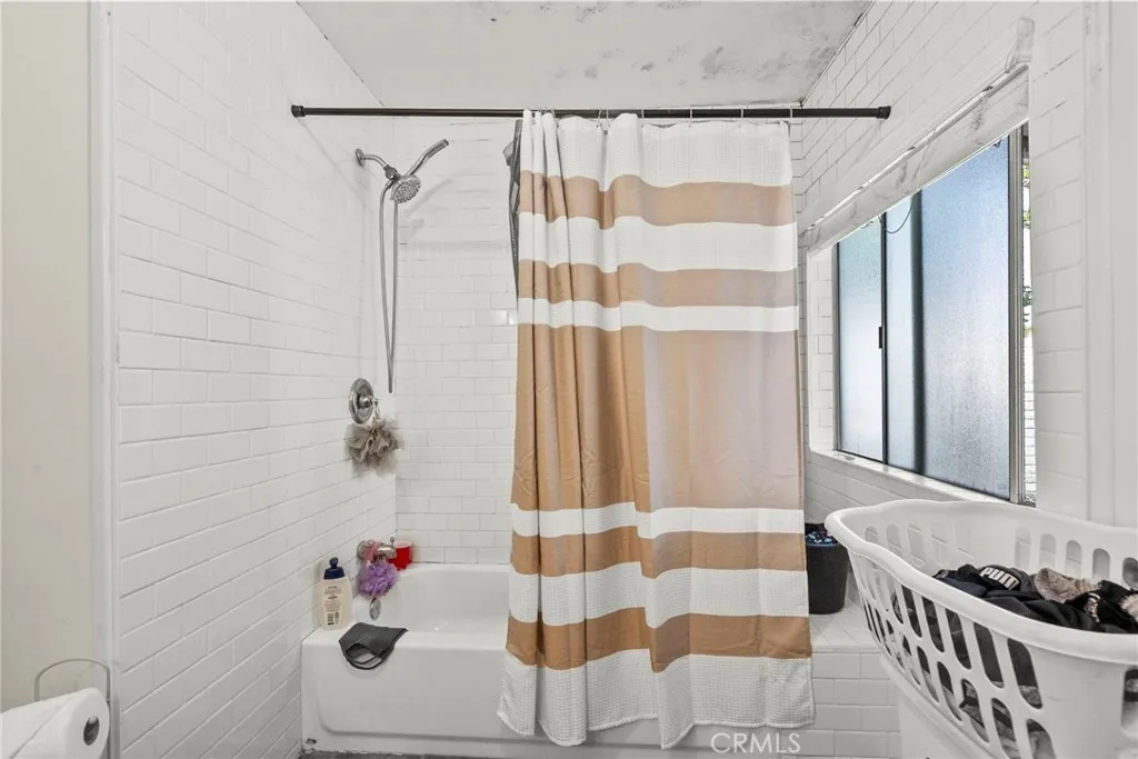 17701 South Avalon, Unit 81 Carson, CA 90746 - Photo 17 of 26 a bathroom with a sink and a shower