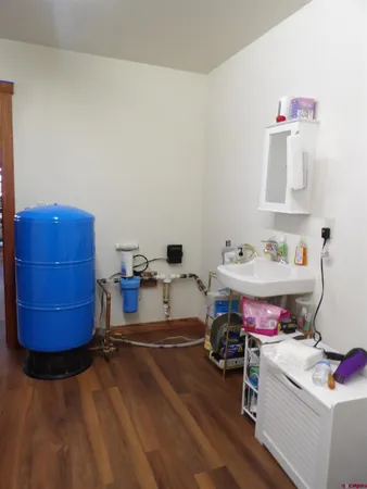 a picture of a bathroom with a sink and a mirror