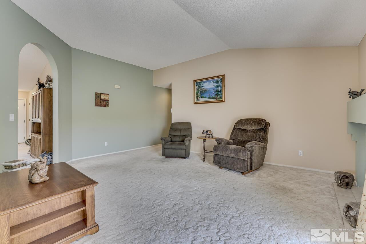 5490 Simons Drive Reno, NV 89523 - Photo 13 of 37 a living room with furniture and a flat screen tv