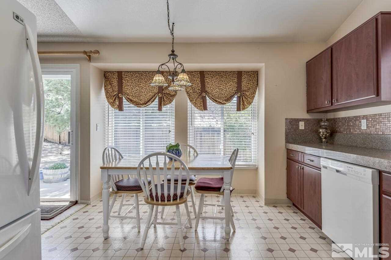 5490 Simons Drive Reno, NV 89523 - Photo 15 of 37 a view of a dining room with furniture window and outside view