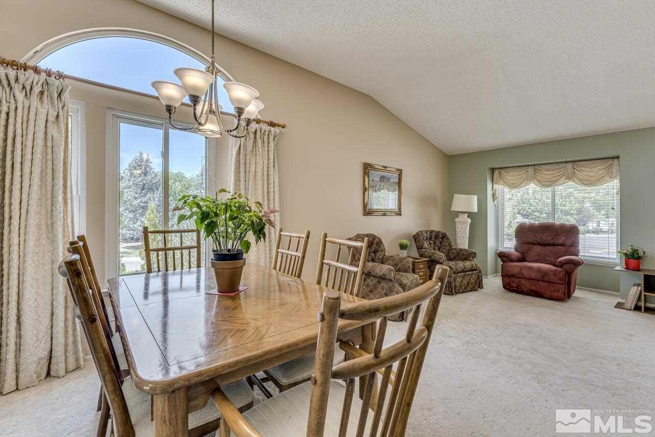 5490 Simons Drive Reno, NV 89523 - Photo 17 of 37 a dining room with furniture a chandelier and window