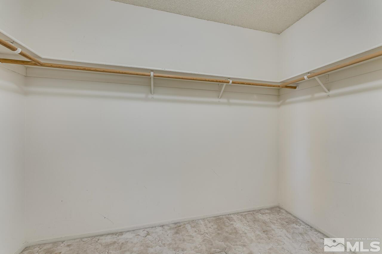 5490 Simons Drive Reno, NV 89523 - Photo 25 of 37 a view of a room with shelf on the wall