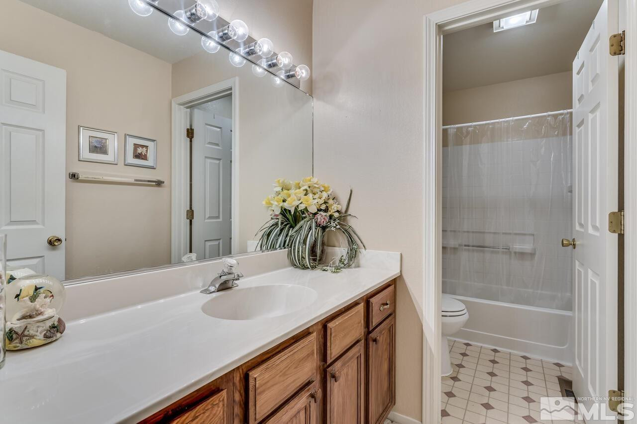 5490 Simons Drive Reno, NV 89523 - Photo 26 of 37 a bathroom with a sink and a mirror