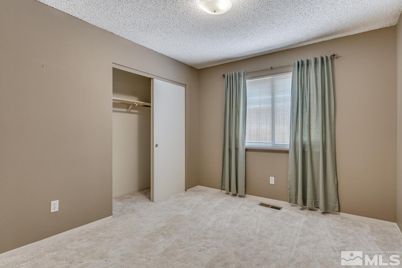 5490 Simons Drive Reno, NV 89523 - Photo 29 of 37 a view of an empty room with closet area
