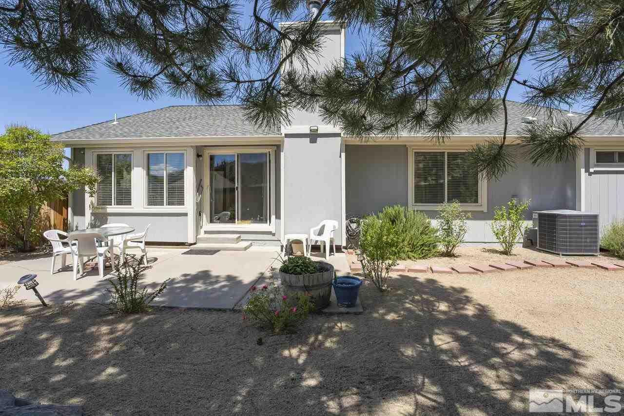 5490 Simons Drive Reno, NV 89523 - Photo 34 of 37 a view of a house with backyard sitting area and porch