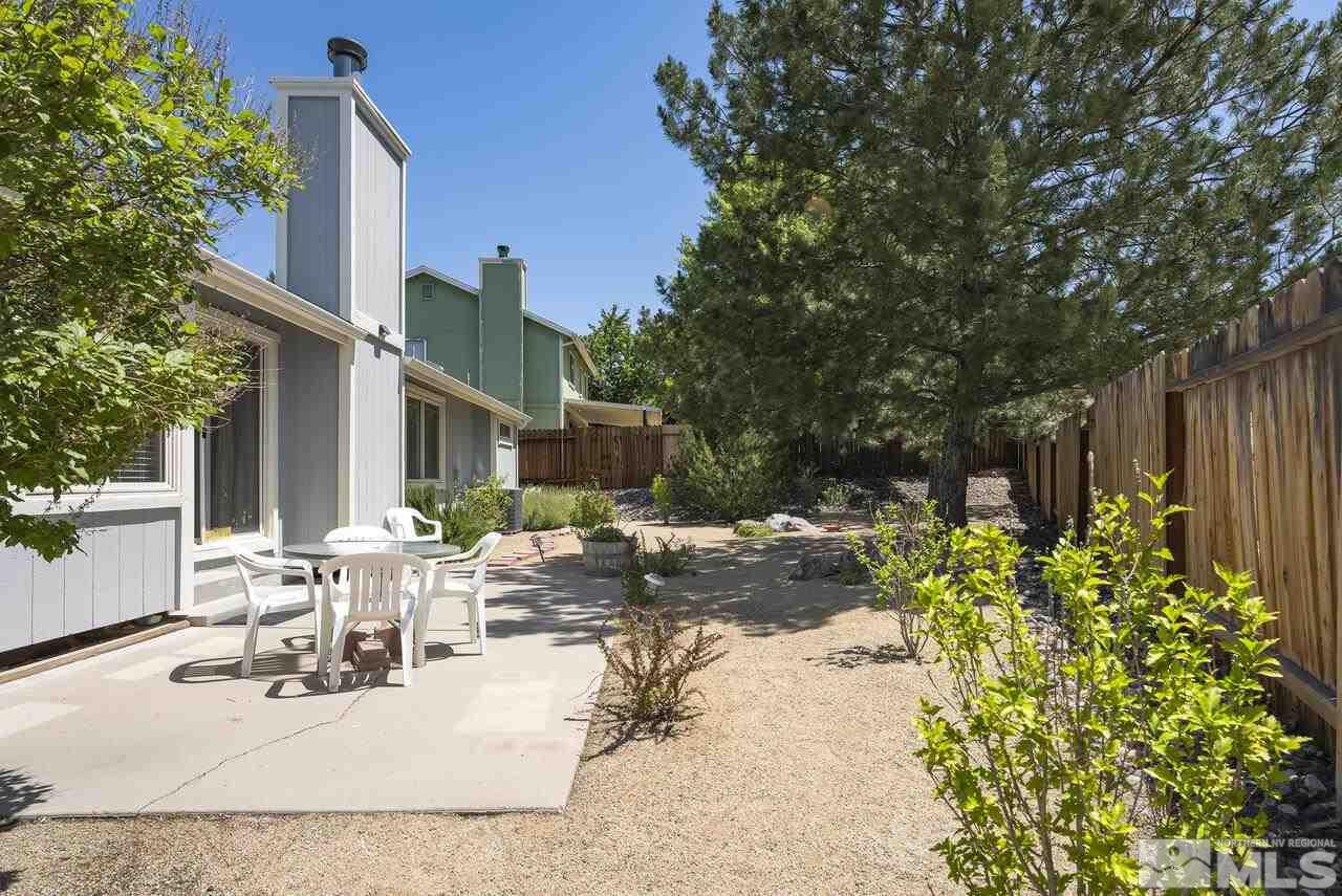 5490 Simons Drive Reno, NV 89523 - Photo 36 of 37 a view of a patio with table and chairs and potted plants