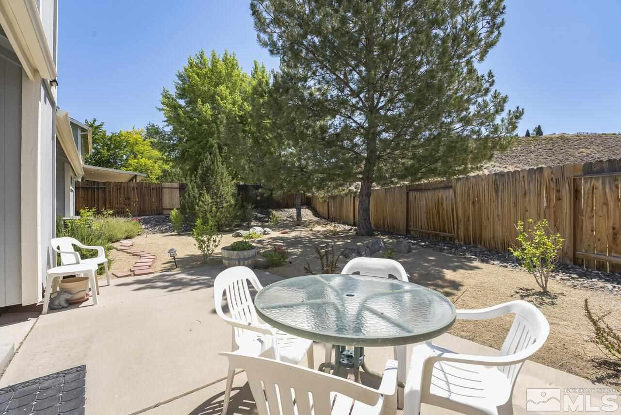 5490 Simons Drive Reno, NV 89523 - Photo 37 of 37 a backyard of a house with yard and outdoor seating