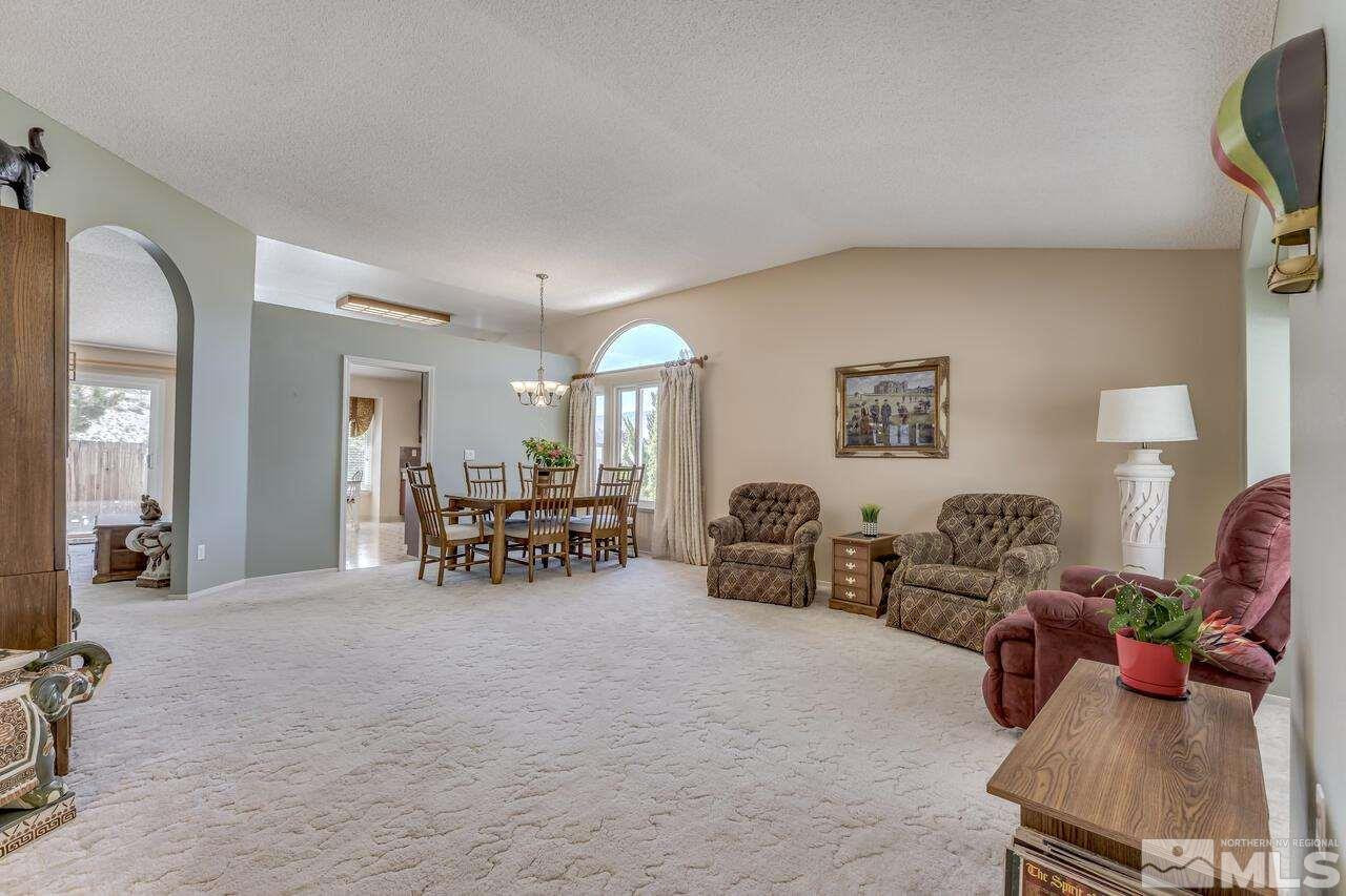 5490 Simons Drive Reno, NV 89523 - Photo 6 of 37 a view of living room filled with furniture and a chandelier