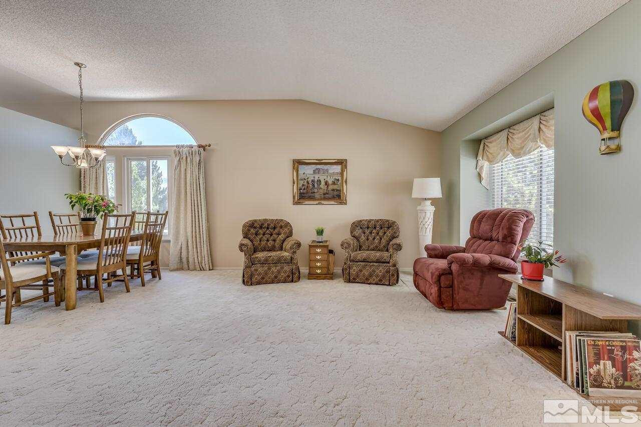 5490 Simons Drive Reno, NV 89523 - Photo 7 of 37 a living room with furniture and a table