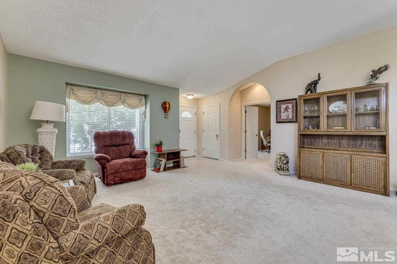 5490 Simons Drive Reno, NV 89523 - Photo 8 of 37 a living room with furniture and a flat screen tv