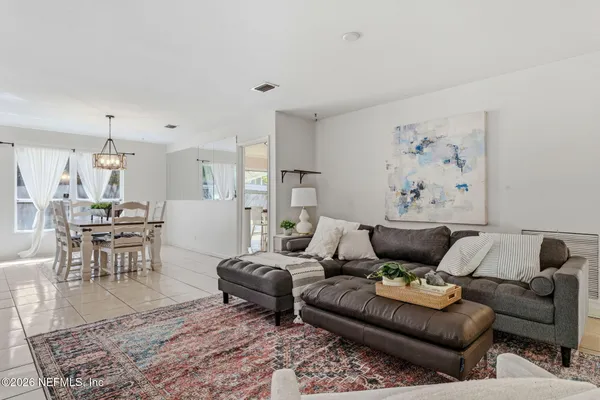 a living room with furniture and a rug