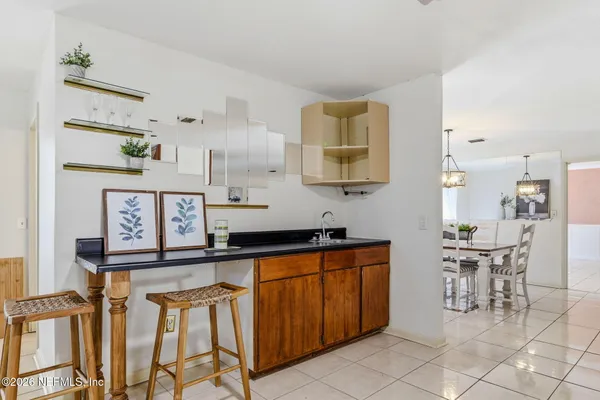 a kitchen with stainless steel appliances a sink and cabinets
