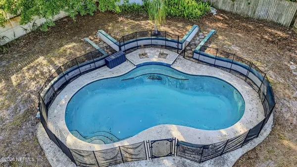 an outdoor sitting area with furniture