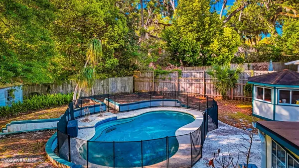 a view of a swimming pool with a patio