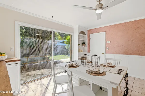a view of a dining room with furniture window and outside view