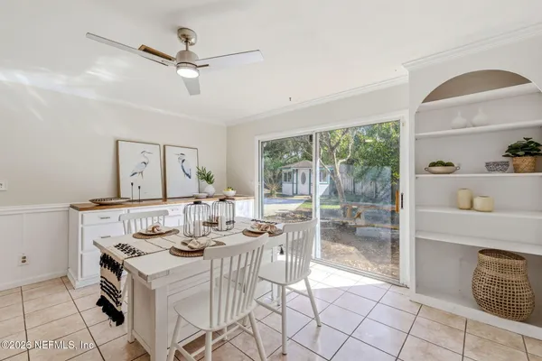 a view of a dining room with furniture window and outside view