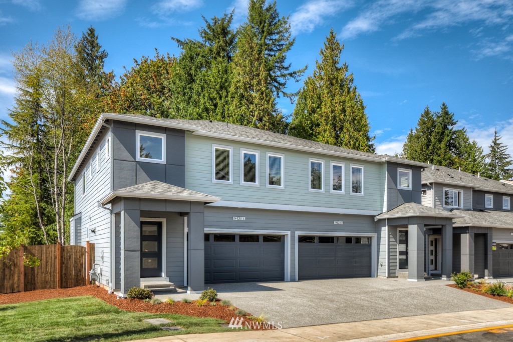 4131 208th Place Southeast, Unit B Bothell, WA 98021 - Photo 3 of 19 a front view of a house with garden