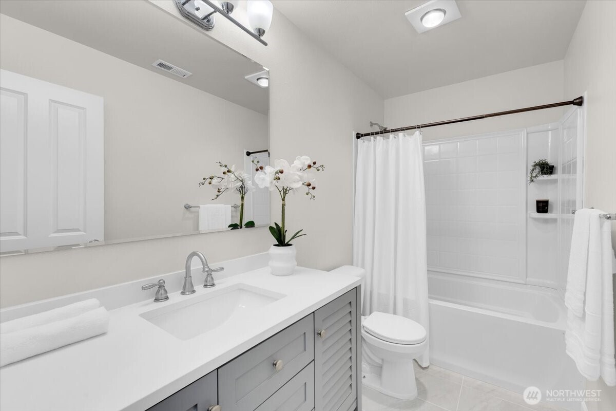 3532 202nd Pl S East Bothell, WA 98012 - Photo 28 of 39 a bathroom with a sink toilet and shower