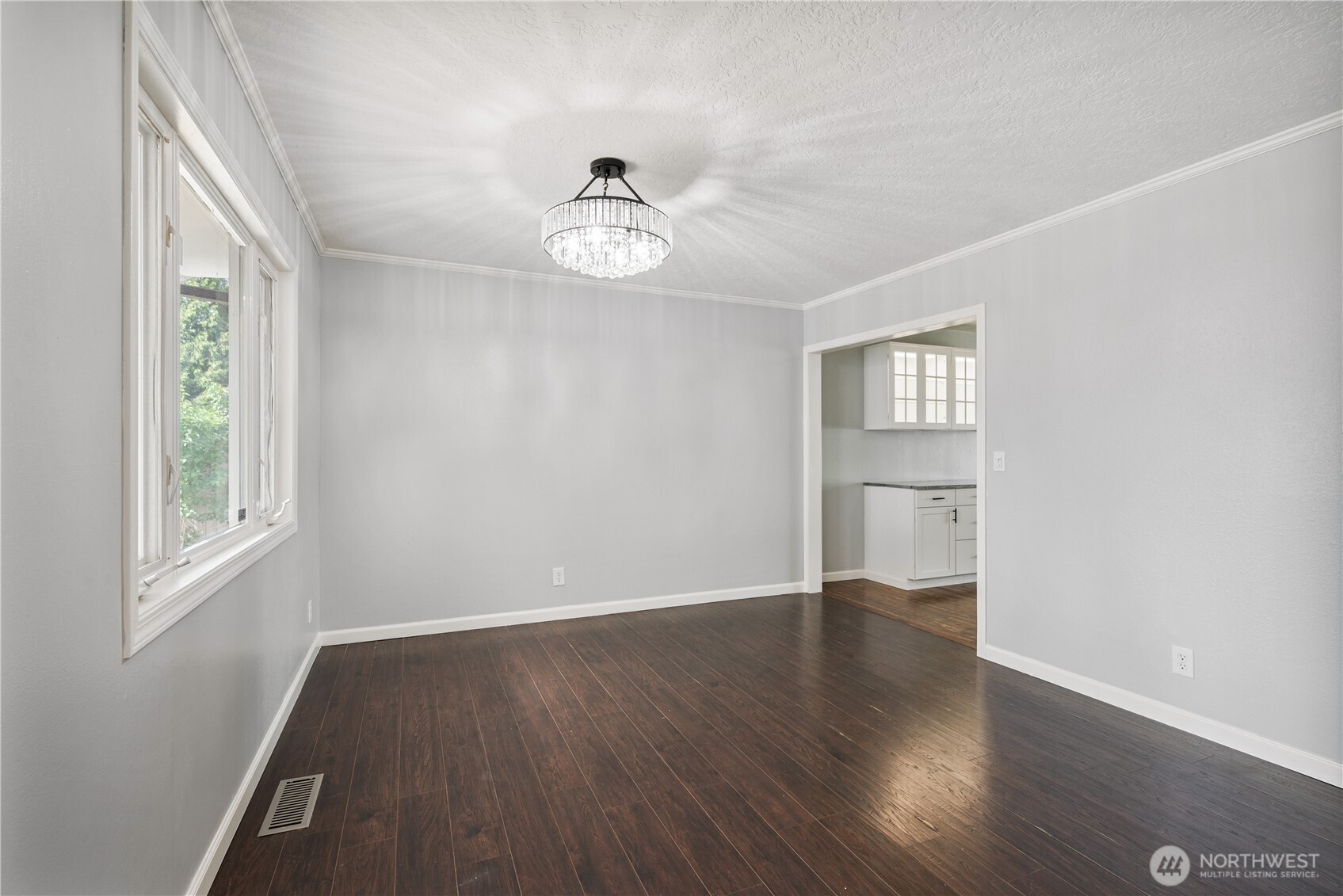 2017 28th Avenue Longview, WA 98632 - Photo 13 of 37 a view of an empty room with a window and wooden floor