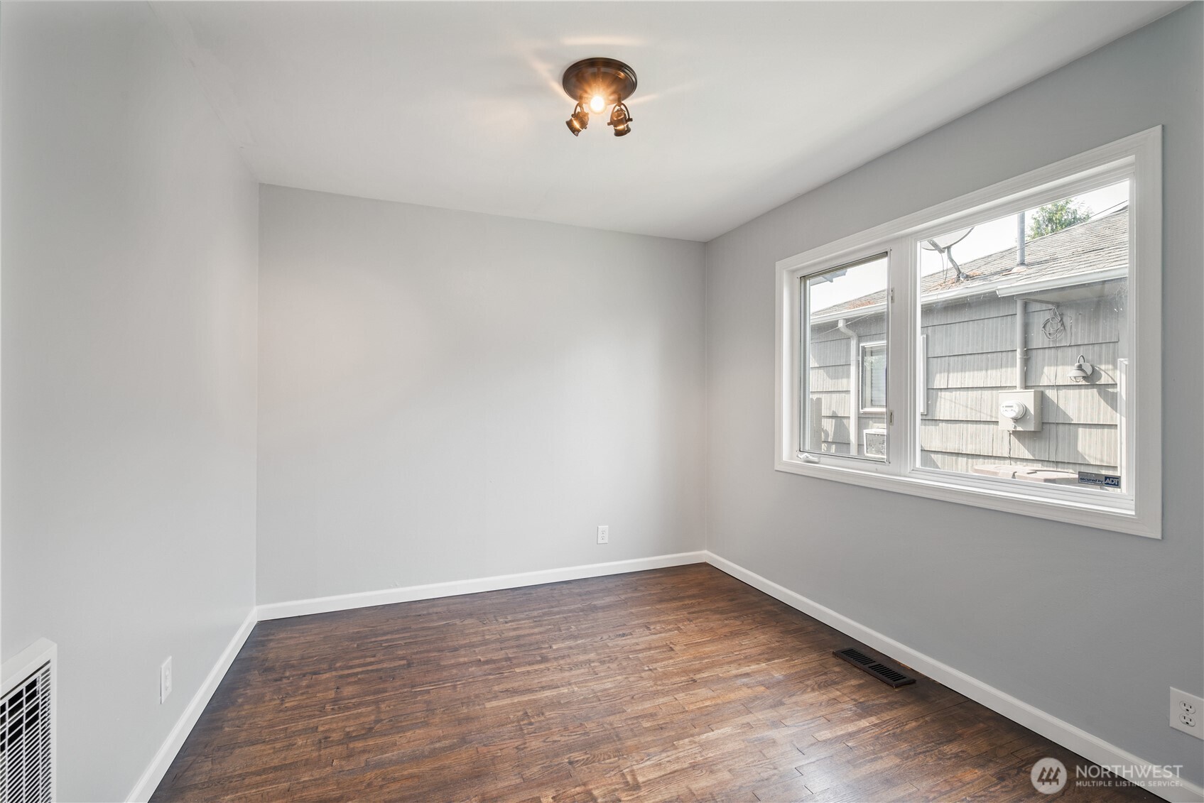 2017 28th Avenue Longview, WA 98632 - Photo 20 of 37 an empty room with wooden floor and windows
