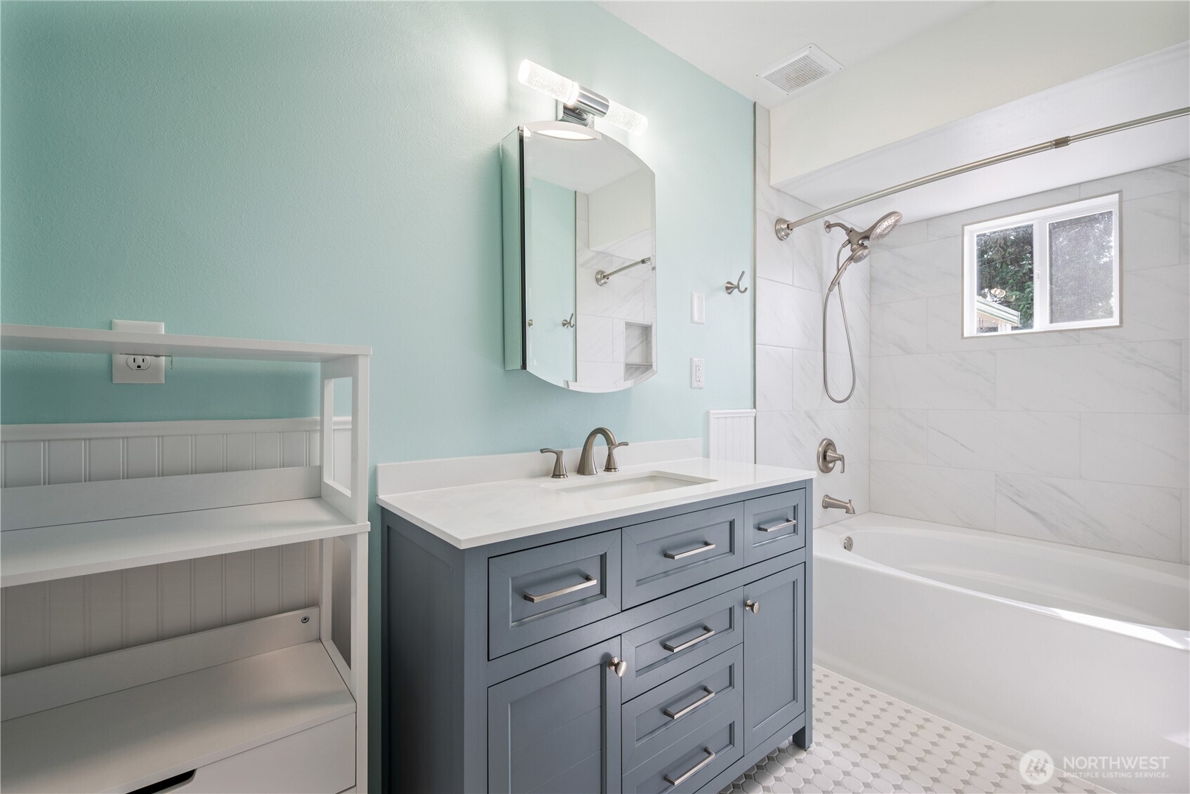 2017 28th Avenue Longview, WA 98632 - Photo 21 of 37 a bathroom with a tub sink and mirror