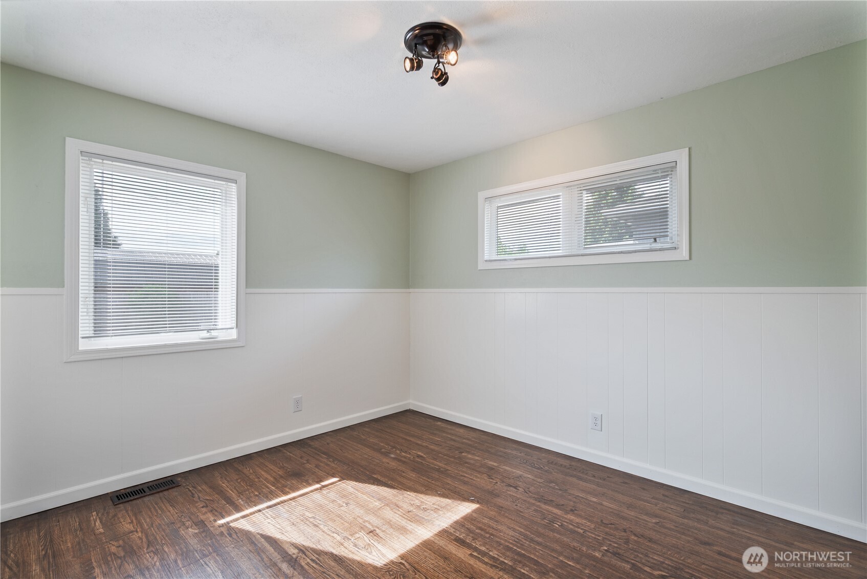 2017 28th Avenue Longview, WA 98632 - Photo 26 of 37 a view of an empty room with wooden floor and a window