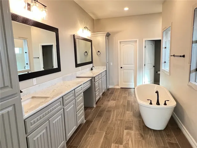 a bathroom with a bathtub and shower