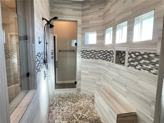 a bathroom with a bathtub and a sink