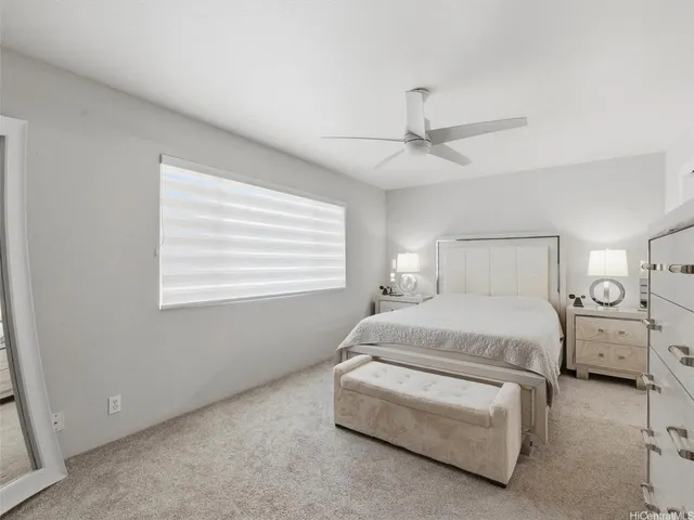 a bedroom with furniture and white walls
