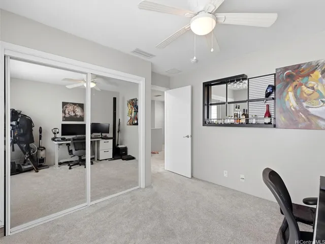 a view of a livingroom with a furniture and closet